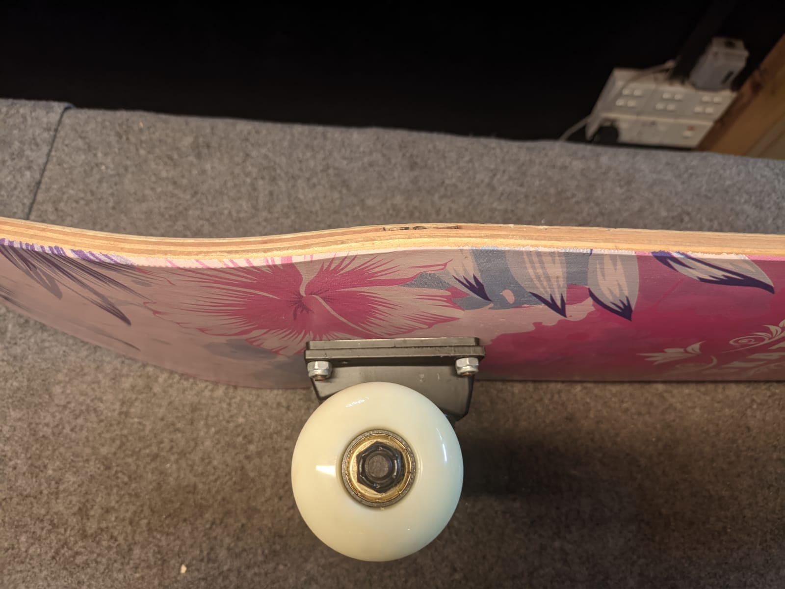 The wheels of a skateboard are fixed in their position.