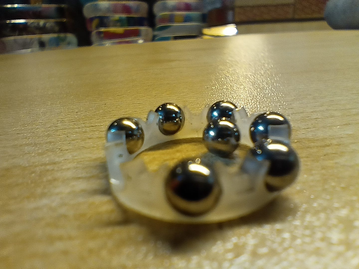 These bearings have nylon retainers to keep the balls evenly spaced around the racers.